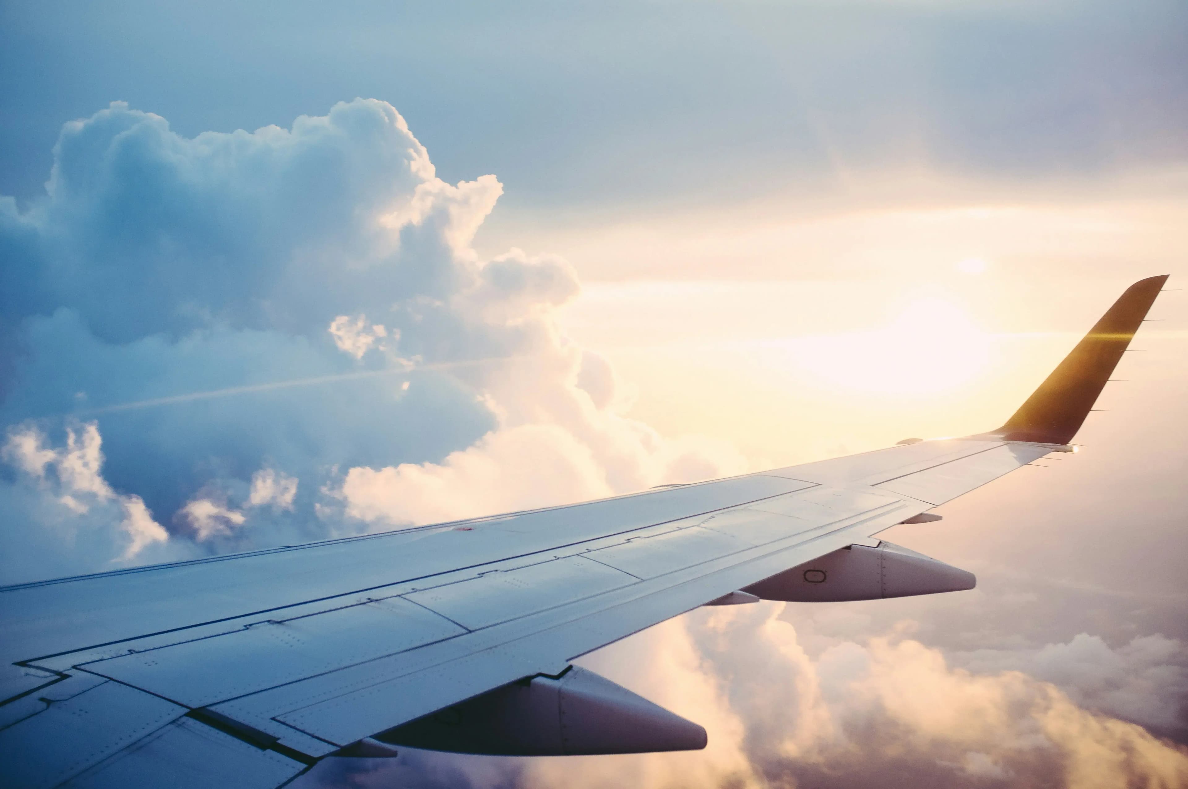 Aircraft wingtip above clouds, Turbcast turbulence forecast hero image